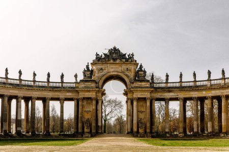 The elaborate arch, surrounded by detailed statues and columns
