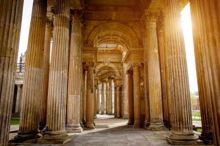 Ancient Roman colonnade with columns and arch