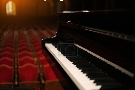 Photo for Piano on stage in an empty concert hall view from the stage - Royalty Free Image