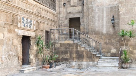 Photo for Courtyard of 14th century Prince Taz Palace in Cairo, Egypt, with staircase leading to the first floor, built by Mamluk Prince Saif Eddin Taz - Royalty Free Image