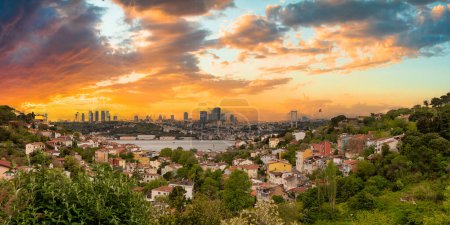 Cityscape of Istanbul, Turkey before sunset, with skyline including Bosphorus strait, tall buildings on the European side, and Bosphorus Bridge before sunset
