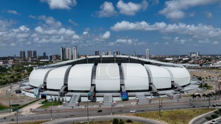 Photo for Panorama aerial view of Dunes Arena Soccer Stadium at downtown city Natal Brazil. Rio Grande do Norte state. Cityscape of tourism landmark city. Sports Center Dunes Arena at downtown Natal Brazil. - Royalty Free Image