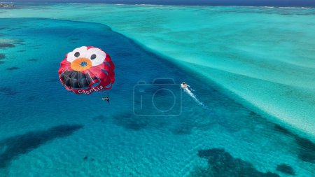 Photo for Parasailing At San Andres In Caribbean Island Colombia. Aquatic Sports. Beach Landscape. San Andres At Caribbean Island Colombia. Tourism Background. Nature Seascape. - Royalty Free Image