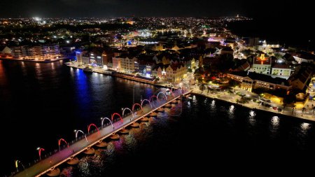 Curacao Skyline At Punda In Willemstad Curacao. Cityscape Skyline. Night Downtown. Punda At Willemstad Curacao. Floating Bridge Landmark. Bright Buildings.