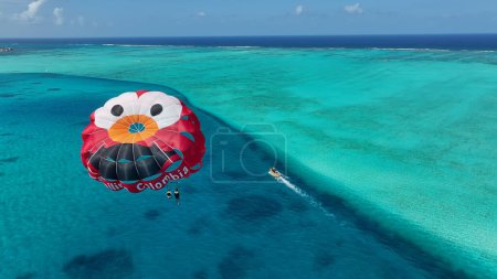 Photo for Parasailing At San Andres In Caribbean Island Colombia. Aquatic Sports. Beach Landscape. San Andres At Caribbean Island Colombia. Tourism Background. Nature Seascape. - Royalty Free Image