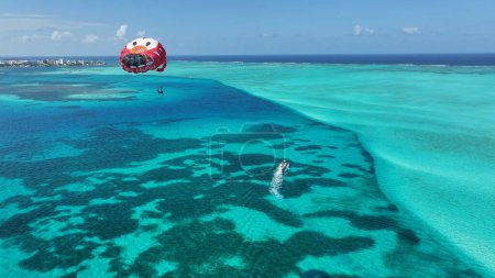 Photo for Parasailing At San Andres In Caribbean Island Colombia. Aquatic Sport. Beach Landscape. San Andres At Caribbean Island Colombia. Tourism Background. Nature Seascape. - Royalty Free Image