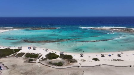 Photo for Baby Beach At Oranjestad In Caribbean Netherlands Aruba. Caribbean Beach. Blue Sea Background. Oranjestad At Caribbean Netherlands Aruba. Tourism Landscape. Nature Seascape. - Royalty Free Image