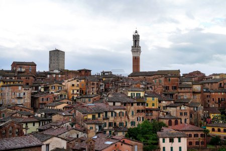 Photo for Siena skyline on a cloudy day. Rooftop view of medieval city of Siena. Tuscany, Italy - Royalty Free Image