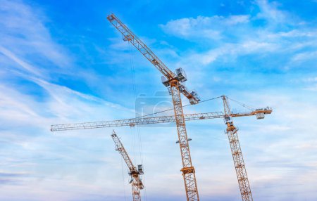Photo for Construction tower crane against the blue sky. - Royalty Free Image