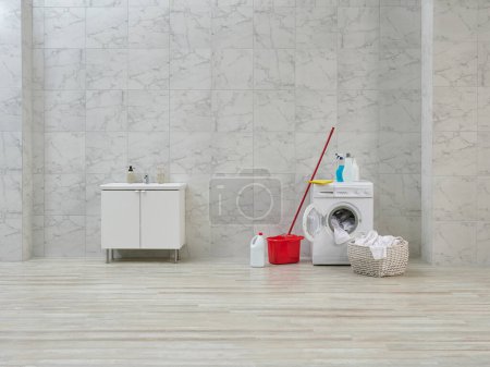 Photo for Cleaning kits in the bath room, white cabinet and sink, washing machine. - Royalty Free Image