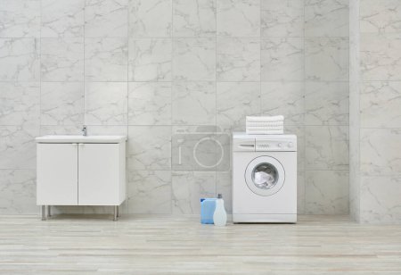 Photo for Washing machine and cabinet and sink in the white bathroom, cleaning materials, dirty clothes in the basket style. - Royalty Free Image