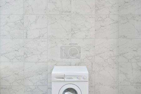 Photo for Close up washing machine up style with towel, brush and cleaning kits in the bath room wall. - Royalty Free Image