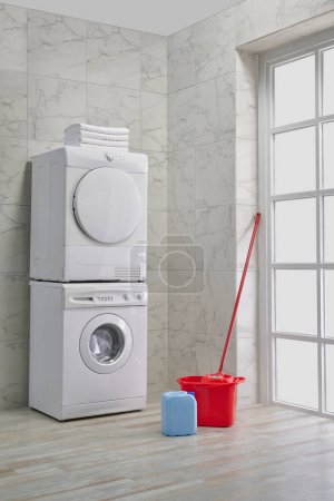 Téléchargez les photos : Machine à laver et sécher en rangée, kits de nettoyage, style salle de bain décorative, concept d'angle. - en image libre de droit
