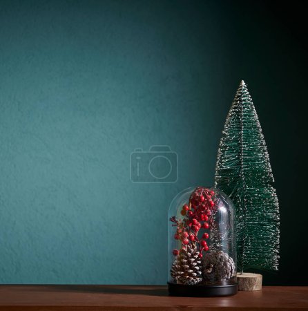 Photo for Christmas and new year accessory on the table and green background, cone, tree, frame. - Royalty Free Image