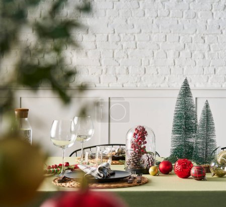 Photo for Christmas and new year dinner table serving, green tablecloth, accessory, tree, interior, white brick wall. - Royalty Free Image
