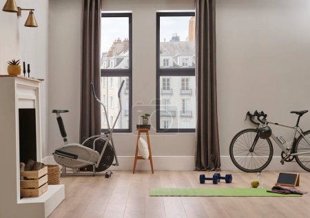 Sport in the home concept with bike and mat, wall chair and room interior style.