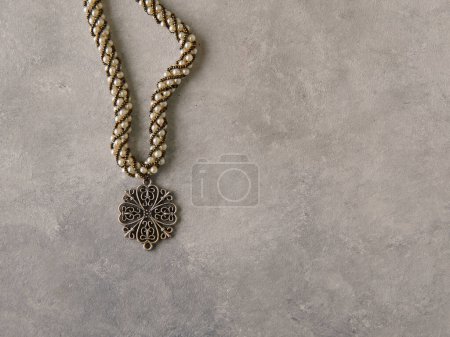 Foto de Elegant jewelry set ring, necklace and earrings with diamonds.Product still life concept. Modern and decorative textured background. - Imagen libre de derechos