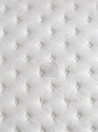 Foto de Superficie de la cama de cerca estilo, cara acolchada, blanco. - Imagen libre de derechos