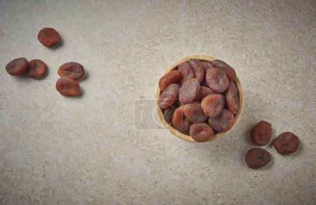 Photo for Delicious dried apricots and dry fruits on the background, close up style, in the plate still life. - Royalty Free Image