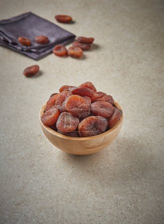 Photo for Delicious dried apricots and dry fruits on the background, close up style, in the plate still life. - Royalty Free Image