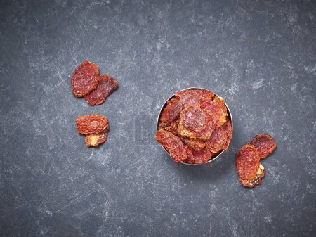 Photo for Delicious dry tomato and dry fruits on the background, close up style, in the plate still life. - Royalty Free Image