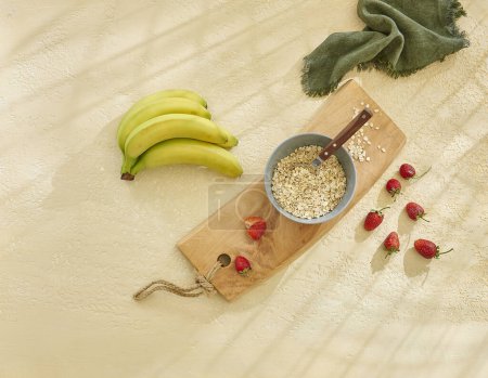 Photo for Granola and various fruits vitamins on the wooden table, yellow banana. - Royalty Free Image