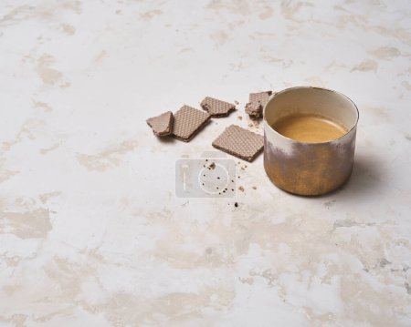 Photo for Dessert wafer and ceramic glass coffee on the decorative background style. Woman hand detail. - Royalty Free Image