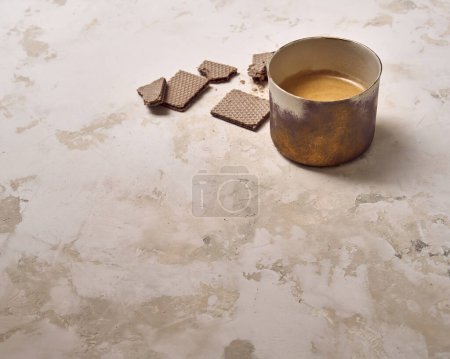 Photo for Dessert wafer and ceramic glass coffee on the decorative background style. Woman hand detail. - Royalty Free Image