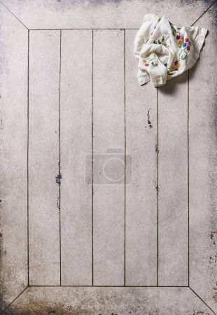 Photo for Napkin on the old table, up shooting, plate and kitchen tools style. - Royalty Free Image