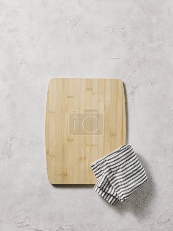Photo for Wooden cutting board on the decorative table, view from above, napkin, empty, textured background. - Royalty Free Image