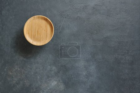 Photo for Wood plate on the textured background table style. - Royalty Free Image