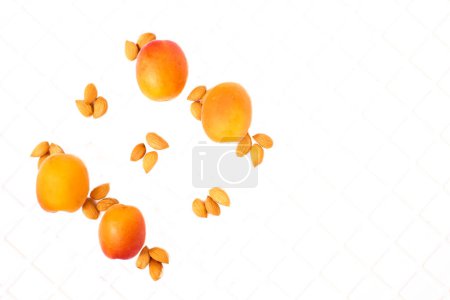 Taste of summer.Fresh ripe apricot fruits isolated on white plastic checkered                               