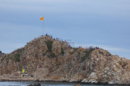 Photo for Catalan flag with red and yellow stripes on top of a rock - Royalty Free Image