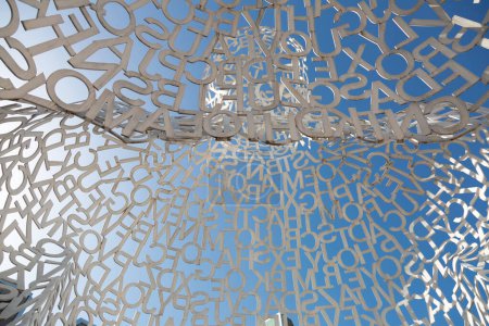 Modern art installation by spanish artist jaume plensa displayed under blue sky in zaragoza