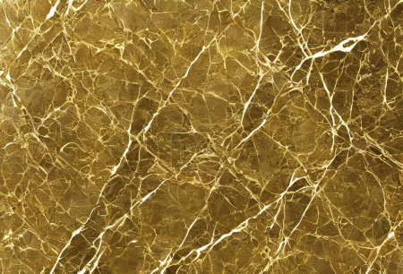 Photo for Golden marble texture with many contrasting textures. The abstract gold marble can also be used to create surface effects on architectural floors; ceramic floors and wall tiles. - Royalty Free Image