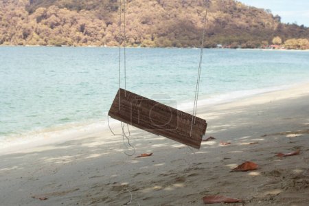 Photo for Infrared image of the single rope bench swing by the beach. - Royalty Free Image