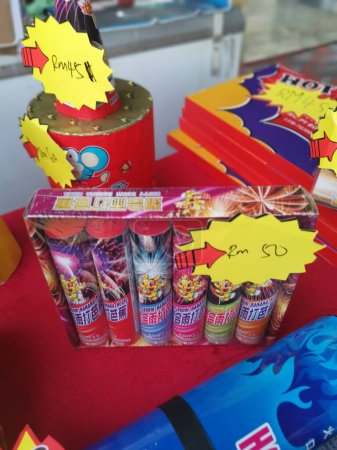 Photo for Perak,Malaysia. January 8, 2023:Variety of different types firecrackers with discounts for the coming Chinese New Year celebration on display and sale at Kg Koh Backstreet Stalls. - Royalty Free Image