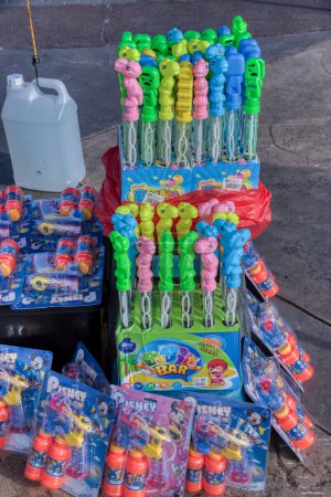 Photo for Perak,Malaysia. August 2,2023: Plastic stick mini soap Bubble toy for kids on display for sale at the Waterfront playground park,Bagan Datok. - Royalty Free Image