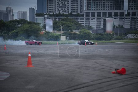 Photo for Distance scene of amateur driver practicing car drifting. - Royalty Free Image
