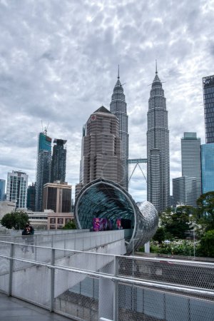 Photo for Kuala Lumpur. Malaysia. January 12, 2024. The famous visiting place known as saloma bridge nearby the Malaysian Petronas Twin Tower. - Royalty Free Image
