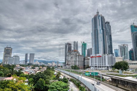 Photo for Kuala Lumpur. Malaysia. January 12, 2024. Highway street just below the famous Saloma bridge nearby the Malaysian Petronas Twin Tower. - Royalty Free Image