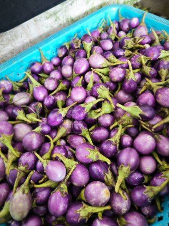 basket of mini baby purple eggplant.