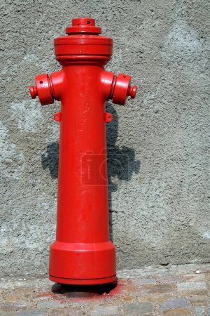Old red fire hydrant on the street. Fire hidrant for emergency fire access