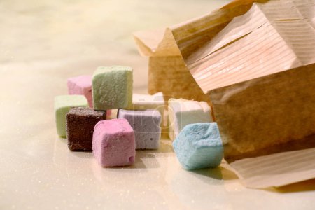 Photo for Taste delicate marshmallow sweets - Royalty Free Image