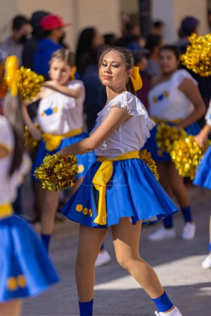 Photo for Matamoros, Tamaulipas, Mexico - November 26, 2022: The Desfile del 20 de Noviembre, Cheerleader team performing at the parade - Royalty Free Image