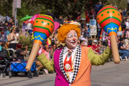 Photo for San Antonio, Texas, USA - April 8, 2022: The Battle of the Flowers Parade, Members of the Jolly Joeys Clown Alley performing at the parade - Royalty Free Image