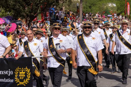 Photo for San Antonio, Texas, USA - April 8, 2022: The Battle of the Flowers Parade, members of the Consejo del Rey Feo Educational Foundation - Royalty Free Image