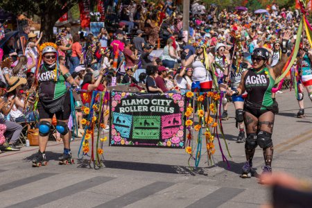 Photo for San Antonio, Texas, USA - April 8, 2022: The Battle of the Flowers Parade, members of the Alamo City Roller Girls - Royalty Free Image
