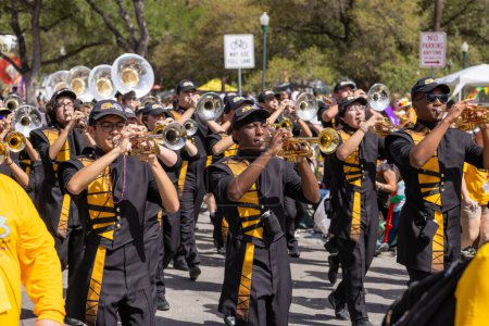 Photo for San Antonio, Texas, USA - April 8, 2022: The Battle of the Flowers Parade, The Brennan High School Band Performing at the parade - Royalty Free Image