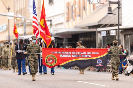 Photo for Brownsville, Texas, USA - February 26, 2022: Charro Days Grand International Parade, Members of the Veterans Memorial Early College High School Marine Corps JROTC, maching in full military uniforms at the parade - Royalty Free Image